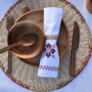 Hand-carved walnut bowl with breakfast or soup on modern kitchen table